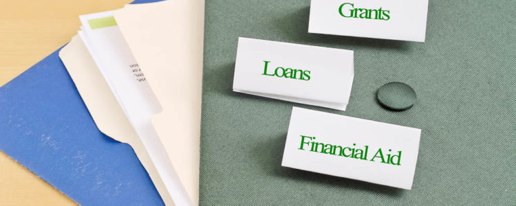 folders on a table with lables that say grants loans and financial aid